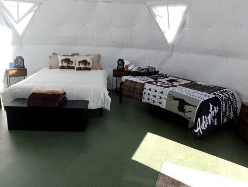 a bedroom with a bed in a tent at Beautiful Dome for a Romantic Glamping Escape with Breathtaking Views in Montana in Plains