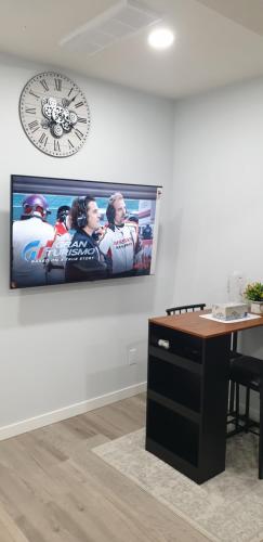 a picture of a hockey game on a wall at Executive 1Bedroom Suite By Henday in Edmonton
