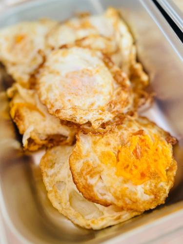 a close up of some fried food in a plate at Umi Resort 菩提有米 in Sihanoukville