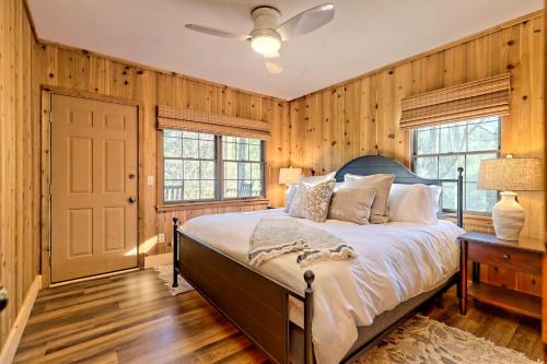 a bedroom with a bed and a ceiling fan at The Spotted Owl in Highlands