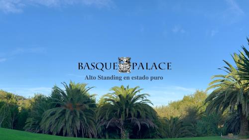 a sign for the boko palace club standing between palm trees at Basque Palace, Mansion con Jardín, Barbacoa, Gimnasio, Piscina, Sauna in Mungia
