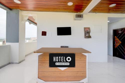 a podium in a room with a hotel sign on it at Hotel O Film City Hyderabad Formerly RJ Residency in Pedda Ambarpet