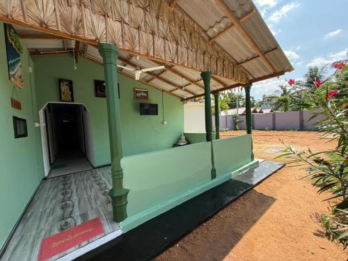 an outside view of a building with a roof at Trikon Villaa in Trincomalee