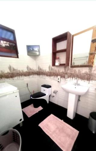 a bathroom with a sink and a toilet and a sink at Lakshmi Villa in Aluthgama