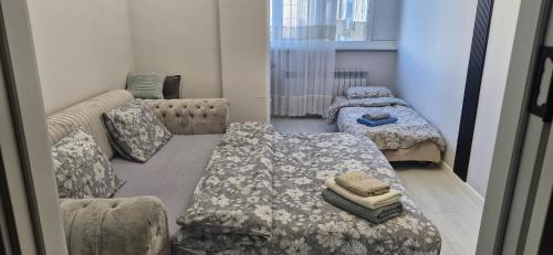 Ένα ή περισσότερα κρεβάτια σε δωμάτιο στο Air-Hotel Moldova