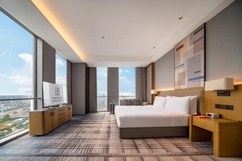 Postel nebo postele na pokoji v ubytování Eastern Wenlan Hotel