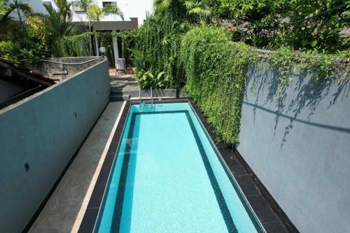 an empty swimming pool in the middle of a building at Hidden Villa in Hikkaduwa