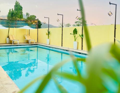 a swimming pool on the side of a building at Heaven hill Pushkar in Pushkar