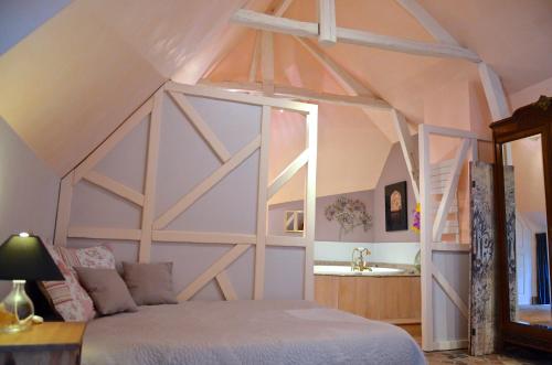 a bedroom with a bed and a sink in a room at Le Café du Village - Bar à cocktails & à Ambiance in Lohéac