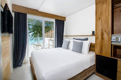 Postel nebo postele na pokoji v ubytování Zuzuni Boutique Hotel