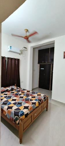 a bedroom with a bed in a room at THE FARM CREST, ECR KADALLUR in Kūvattūr