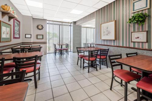 a dining room with tables and chairs at Days Inn by Wyndham Amarillo East in Amarillo