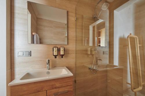 a bathroom with a sink and a shower at Villa Castelle in Marmaris