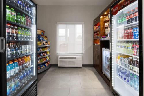 a refrigerator filled with lots of drinks in a store at Wingate by Wyndham Grove City in Grove City