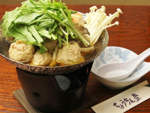 a bowl of food sitting on a table at Chouchinya in Nozawa Onsen