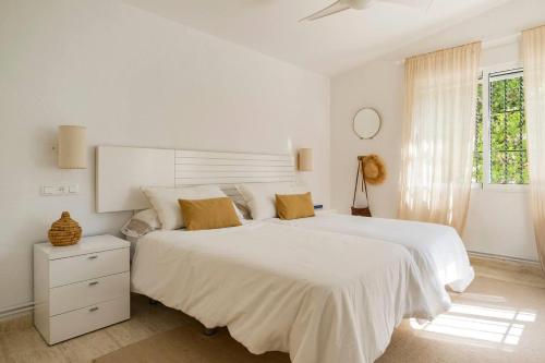 Ένα ή περισσότερα κρεβάτια σε δωμάτιο στο Villa Jardín botánico