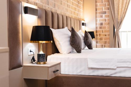 Ένα ή περισσότερα κρεβάτια σε δωμάτιο στο Air Hotel