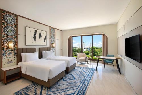 Voodi või voodid majutusasutuse Lotusa Batulicin by Swiss-Belhotel toas