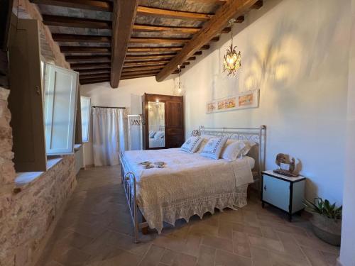 Postel nebo postele na pokoji v ubytování Dimora dei Lustri