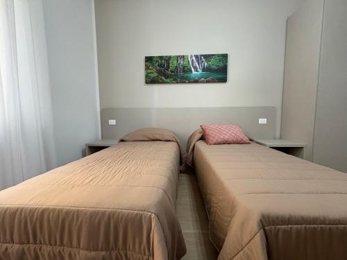 two beds sitting next to each other in a room at Dreams29 in Cosenza