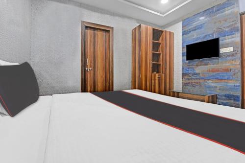 Ένα ή περισσότερα κρεβάτια σε δωμάτιο στο Collection O Mohan Paradise