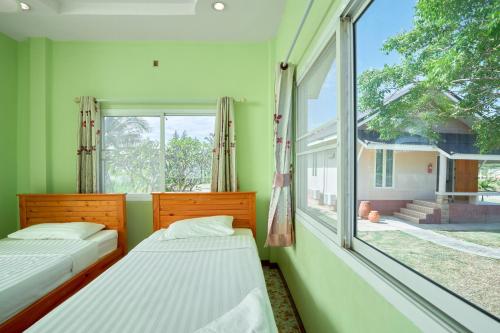 En eller flere senge i et værelse på The Peak Resort Chaiyaphum