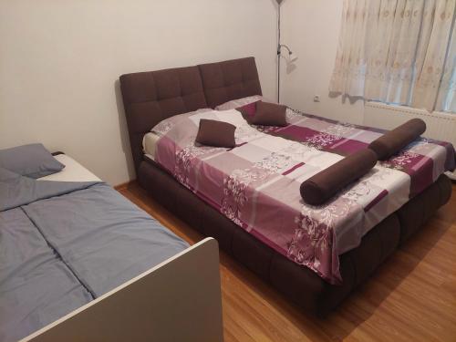 Ένα ή περισσότερα κρεβάτια σε δωμάτιο στο Apartman Sumatra