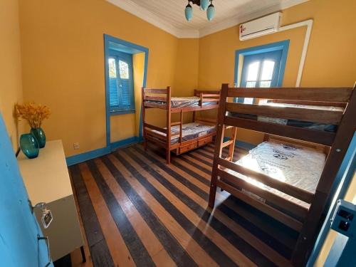 a room with two bunk beds in a room at General Hostel Belém in Belém