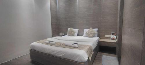 Giường trong phòng chung tại HOTEL O ENERGY SPACE