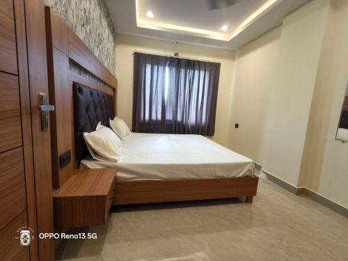 Ένα ή περισσότερα κρεβάτια σε δωμάτιο στο Hotel O NEW CLARK INN & BANQUET