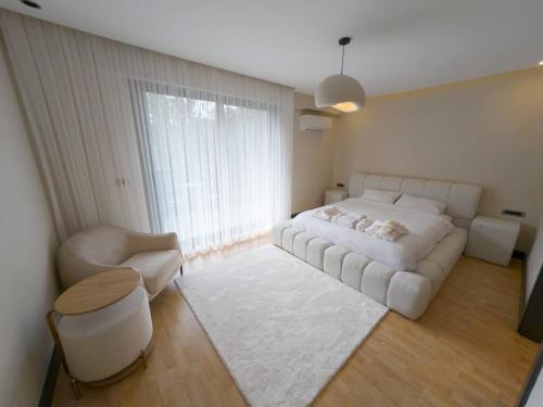 Ένα ή περισσότερα κρεβάτια σε δωμάτιο στο Utopia Suite Residence1