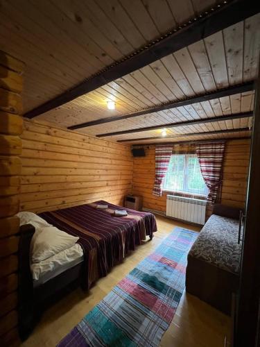 Ένα ή περισσότερα κρεβάτια σε δωμάτιο στο Ліова тиша номер - 3