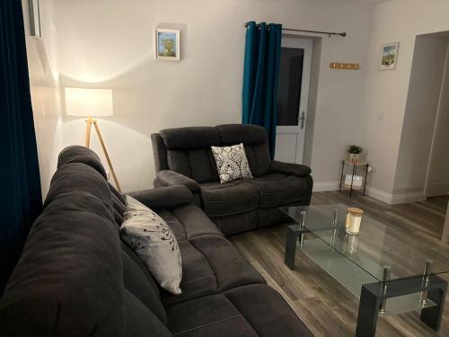 Ein Sitzbereich in der Unterkunft Patsys Cottage