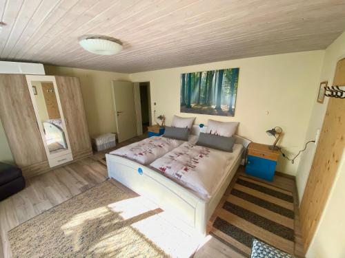 a bedroom with a large bed in a room at Ferienhaus Robin in Titisee-Neustadt