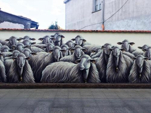 a mural of a herd of sheep on the side of a building at Casa Amore Design - South Sardinia - in San Gavino Monreale