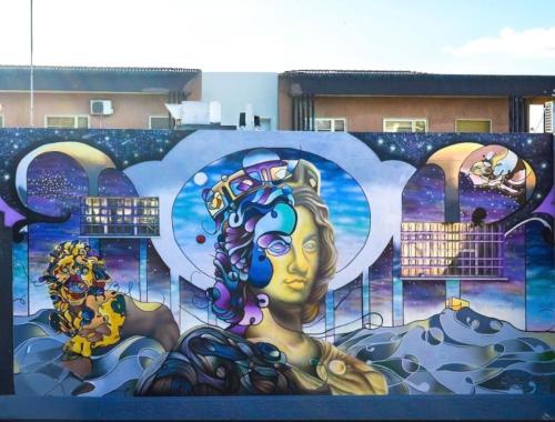 a wall with a painting of a woman on it at Casa Amore Design - South Sardinia - in San Gavino Monreale