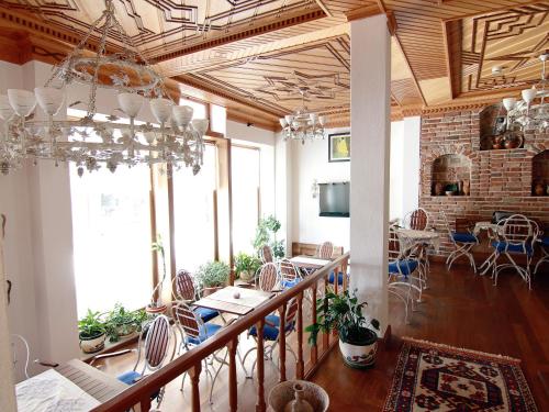 a large room with a table and chairs in it at Hotel Des Etrangers - Special Category in Canakkale