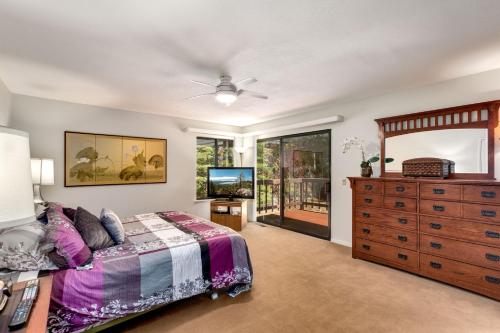 a bedroom with a bed and a dresser at Spacious Riverfront home in Nebelhorn