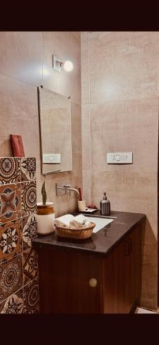 a kitchen with a sink and a counter top at The Niruma Villa in Udaipur