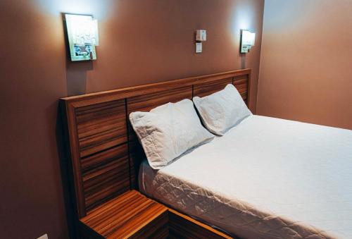 Ένα ή περισσότερα κρεβάτια σε δωμάτιο στο Les Résidences Davina Hope