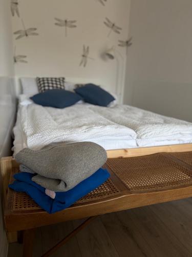 a bedroom with a bed with a wooden frame at Widok na Zamek in Malbork