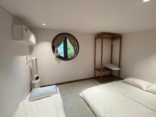 Postel nebo postele na pokoji v ubytování Nhà Gối Homestay - Chạm Bình Yên