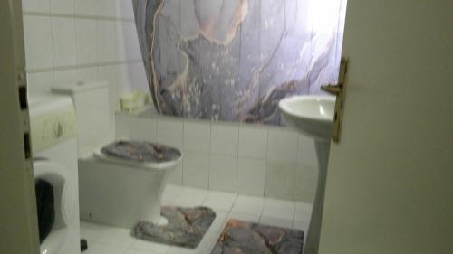 a bathroom with a toilet and a sink at B1 Apt Mytilini in Mytilene