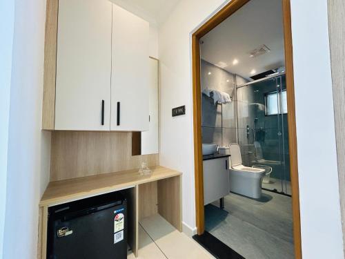 a bathroom with a sink and a toilet and a mirror at Munnar Peak Paradise in Anachal