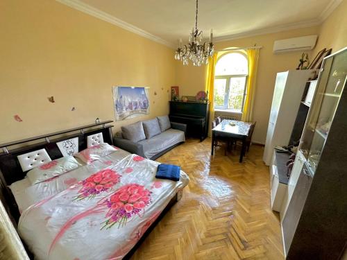 a bedroom with a bed with flowers on it at KAR-SON family guesthouse & Tours in Yerevan