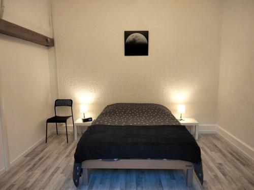 Ένα ή περισσότερα κρεβάτια σε δωμάτιο στο Appartement au bord de l'Yxeure au rez de chaussée avec terrain