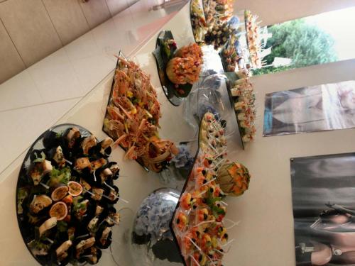 a group of plates of food on a wall at Hotel Byron in Rimini