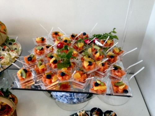 a bunch of food in plastic containers on a table at Hotel Byron in Rimini