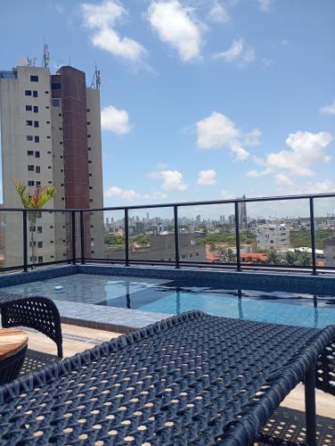 a view of a swimming pool on top of a building at Flat com piscina na cobertura em Intermares in Cabedelo