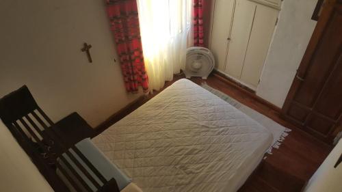 a room with a bed in a room with a window at Mountain house in Costa Blanca in Cuesta Blanca